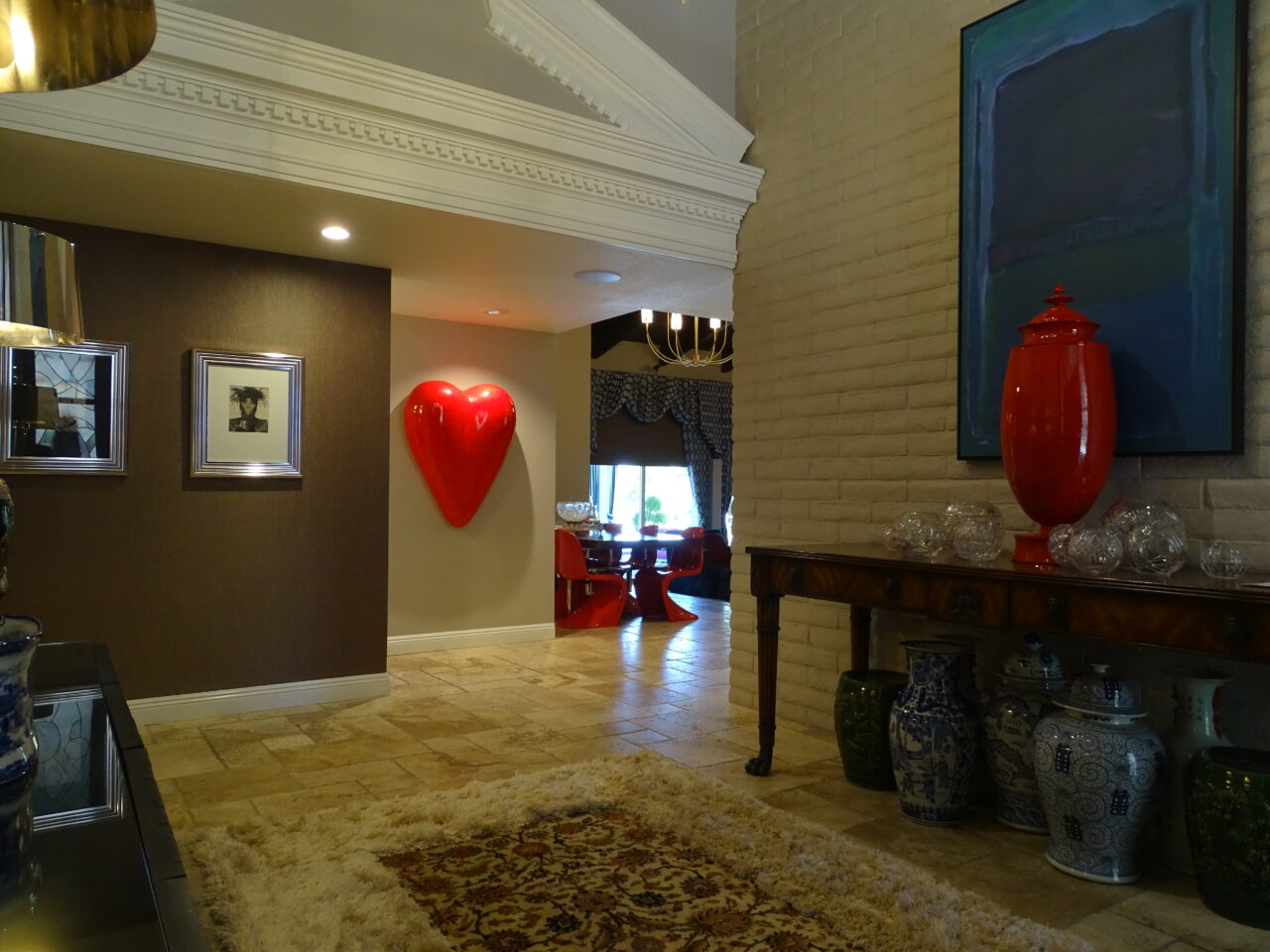 Elegant home interior with heart sculpture and decorative vases.