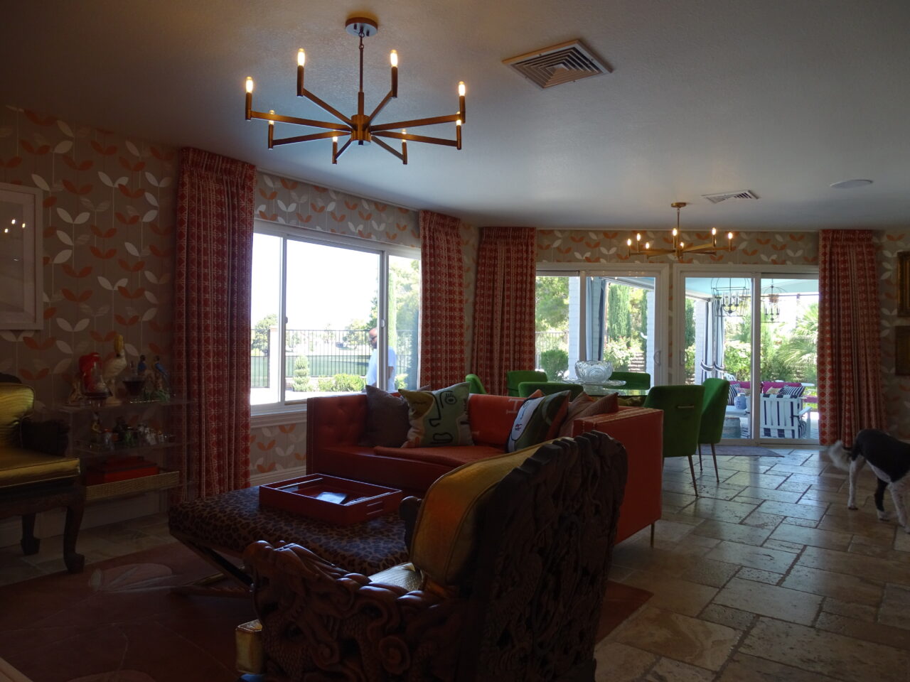 Colorful living room with eclectic decor and bright furnishings.