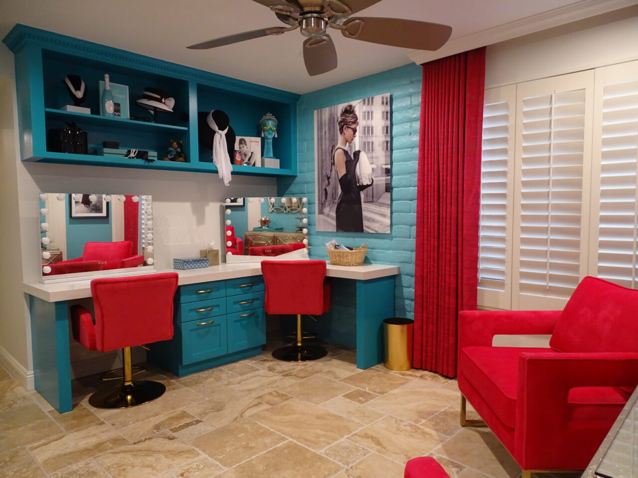 Bright turquoise and red retro styled room with vanity.