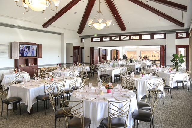 Elegant banquet hall with tables set for event