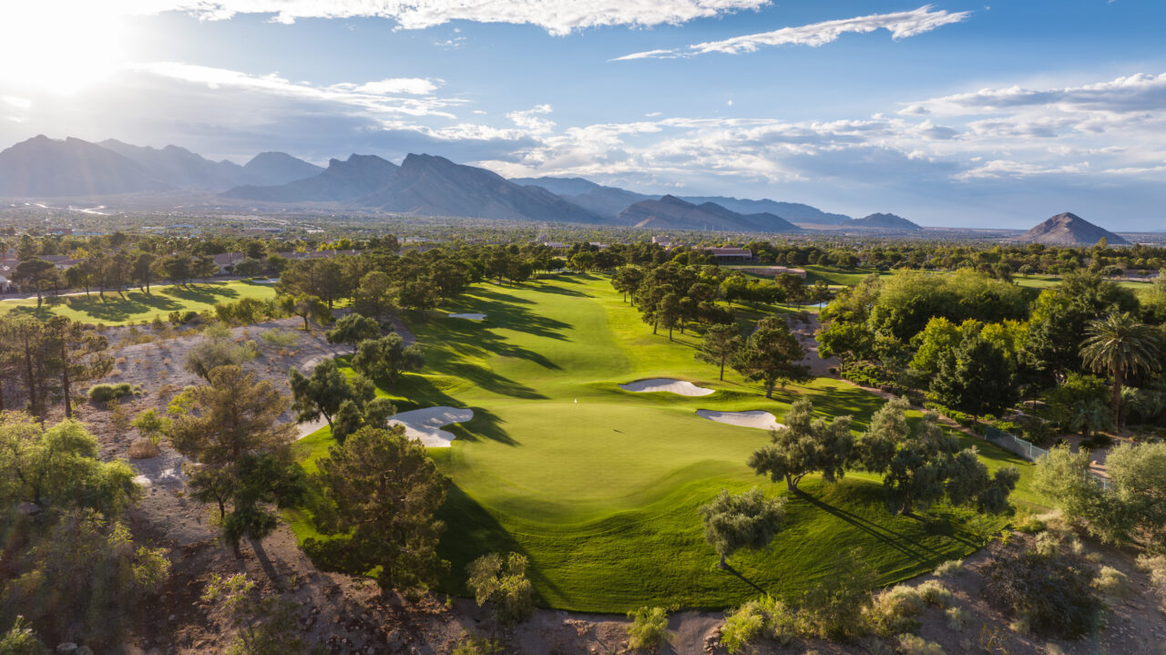 Scenic golf course with mountains in the background