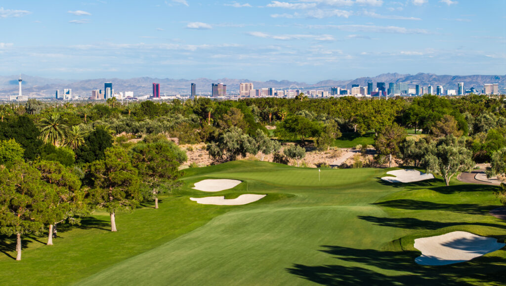 Golf course with view of Las Vegas skyline.