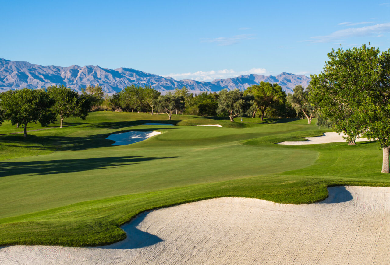 Scenic golf course with mountains in the background