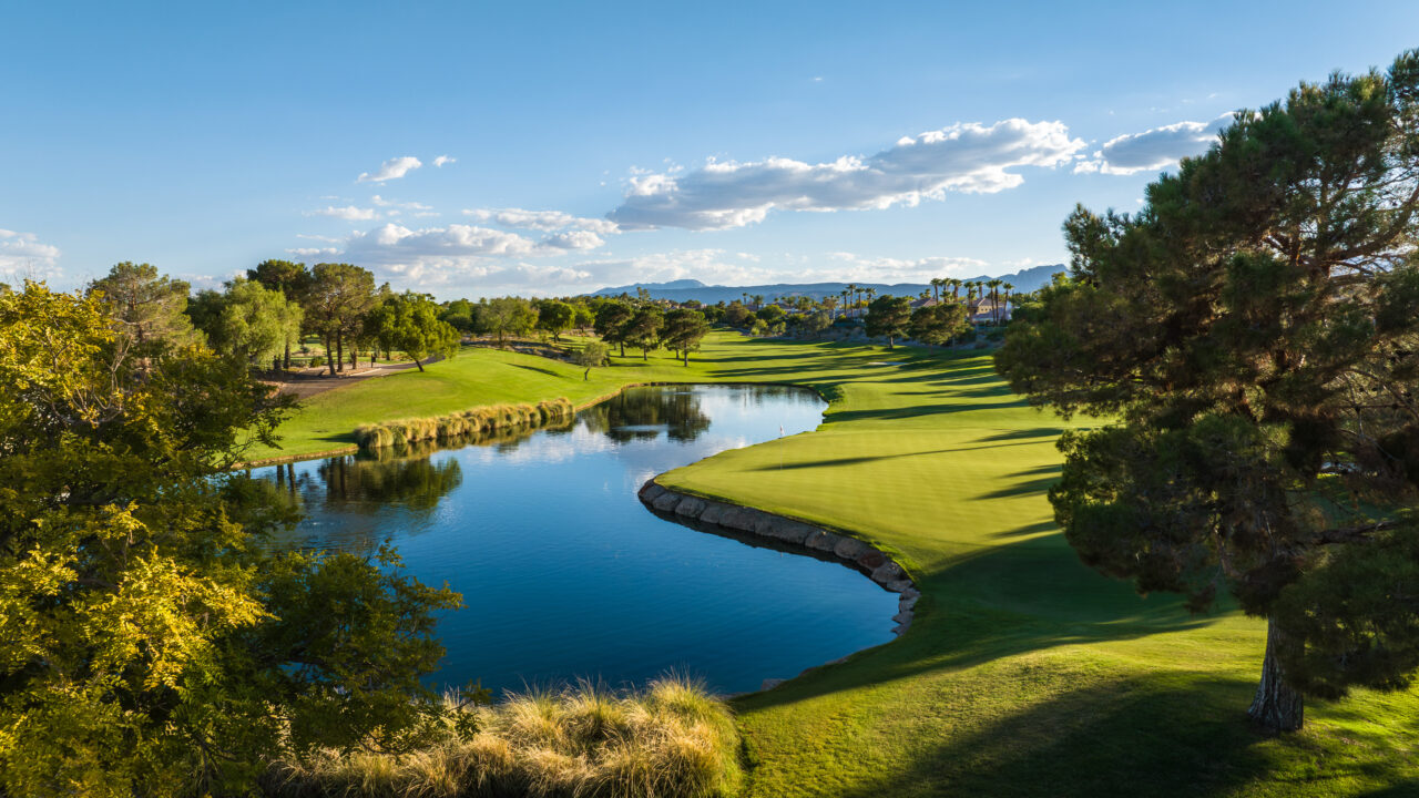 Scenic golf course with lake and lush greenery