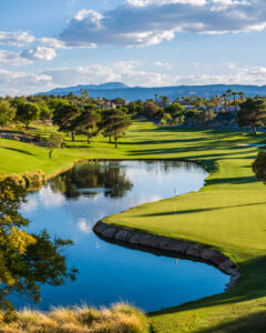 Scenic golf course with lake and mountain backdrop