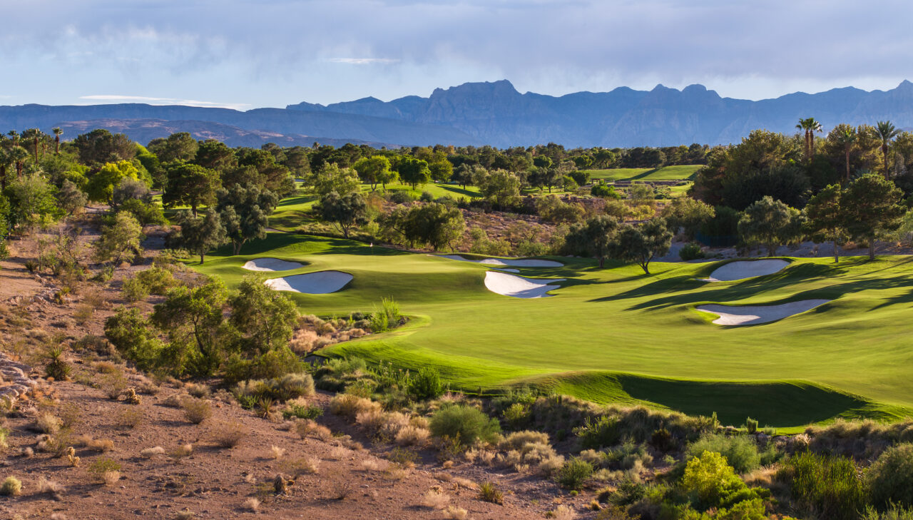 Scenic golf course with mountains and lush greenery