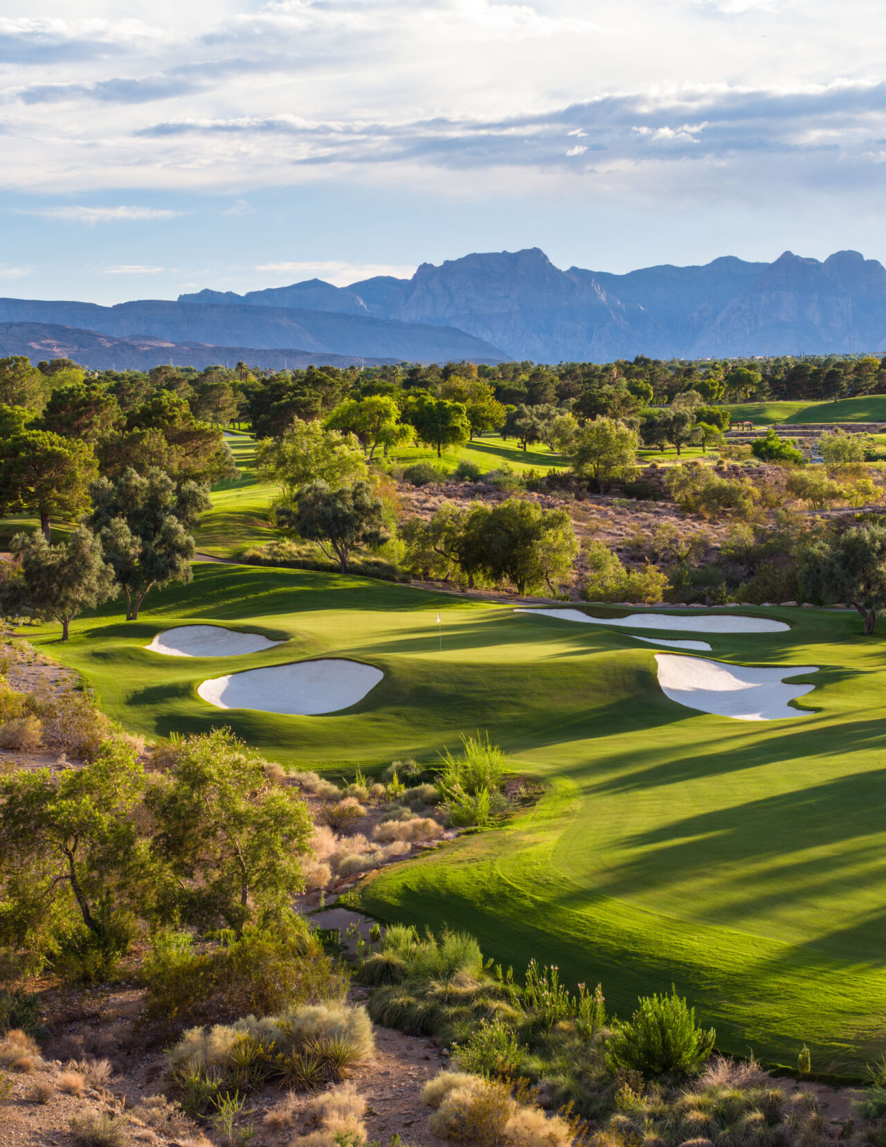 Scenic golf course with mountains in background