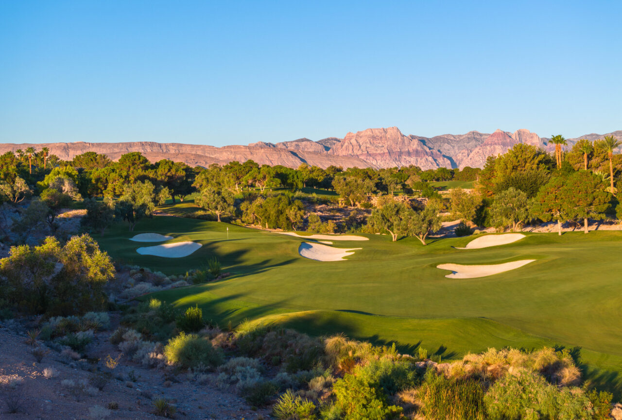 Scenic golf course with mountains in background