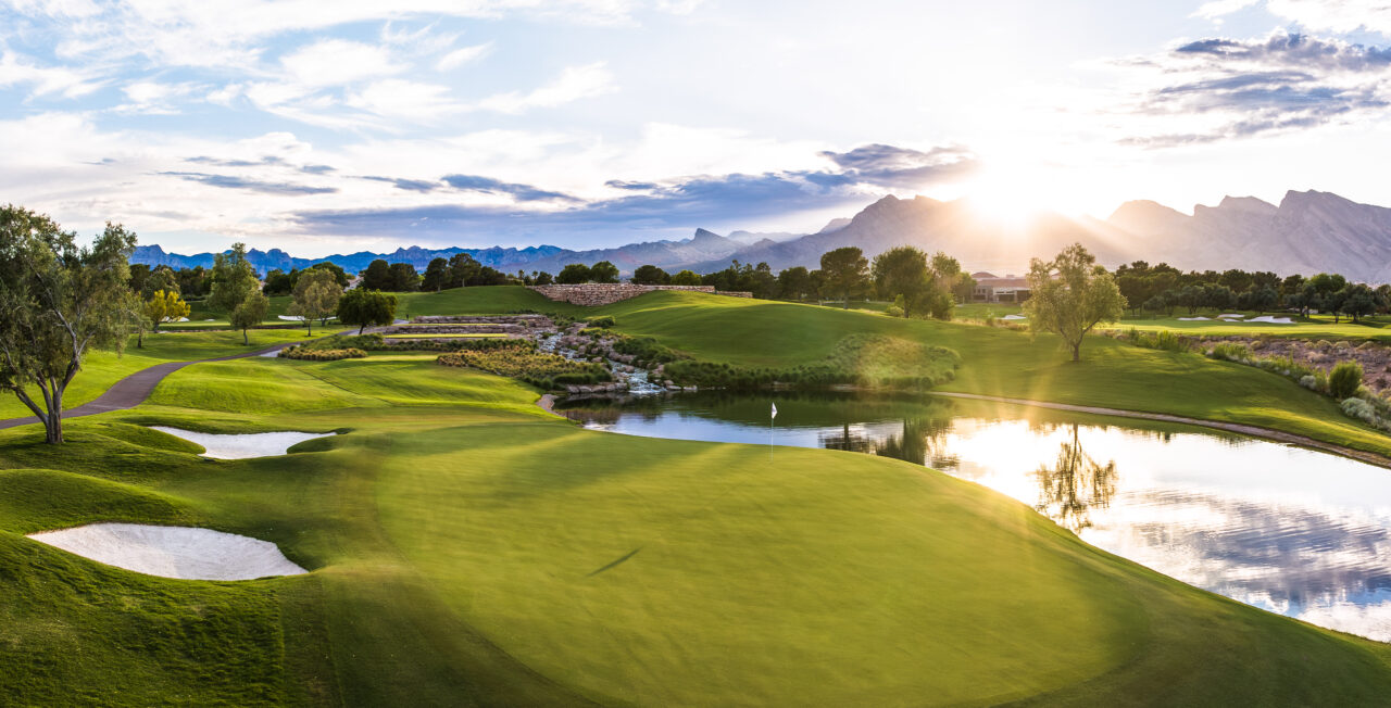 Sunset over scenic golf course with mountains