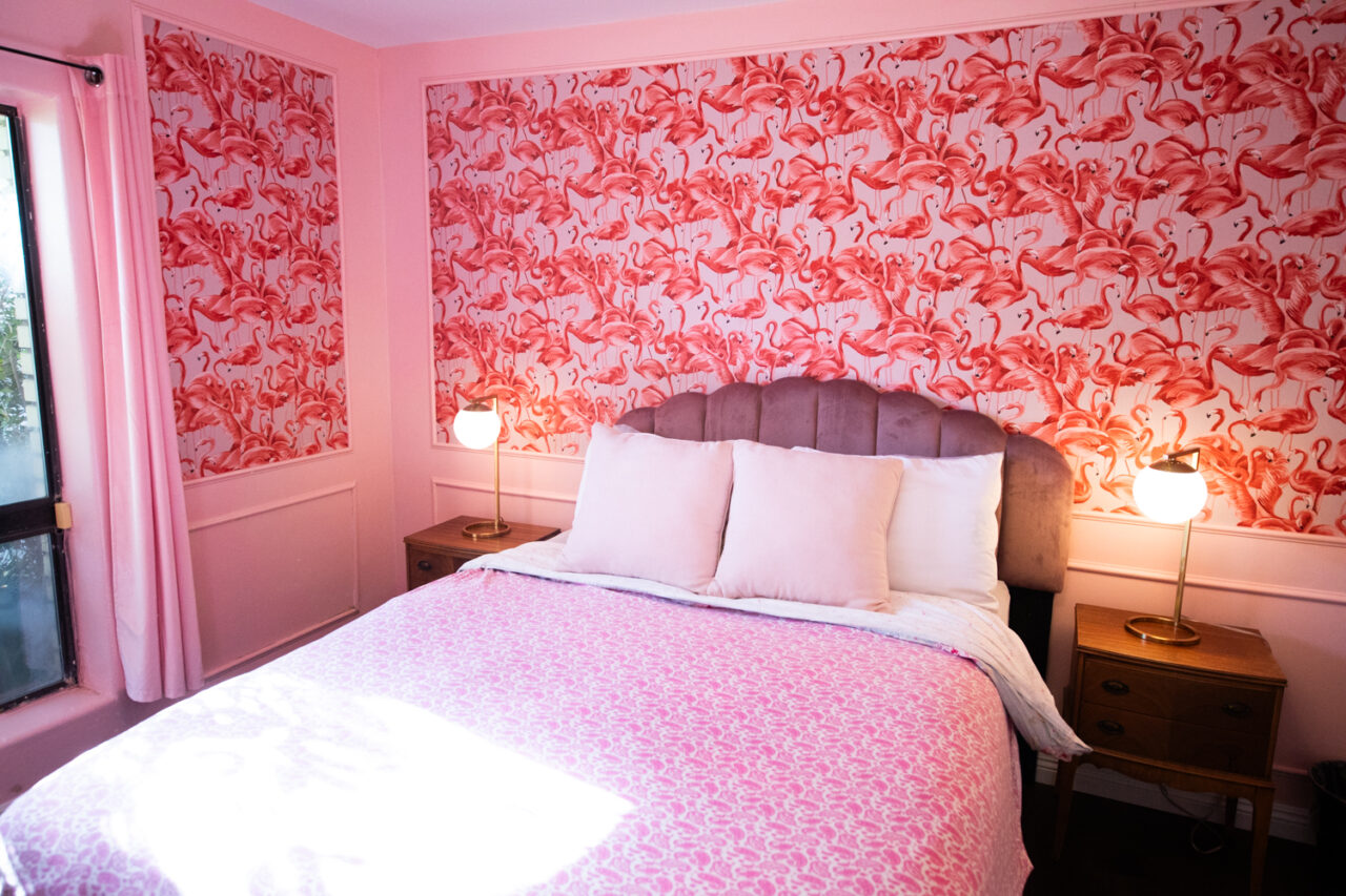 Pink flamingo-themed bedroom decor with plush bedding