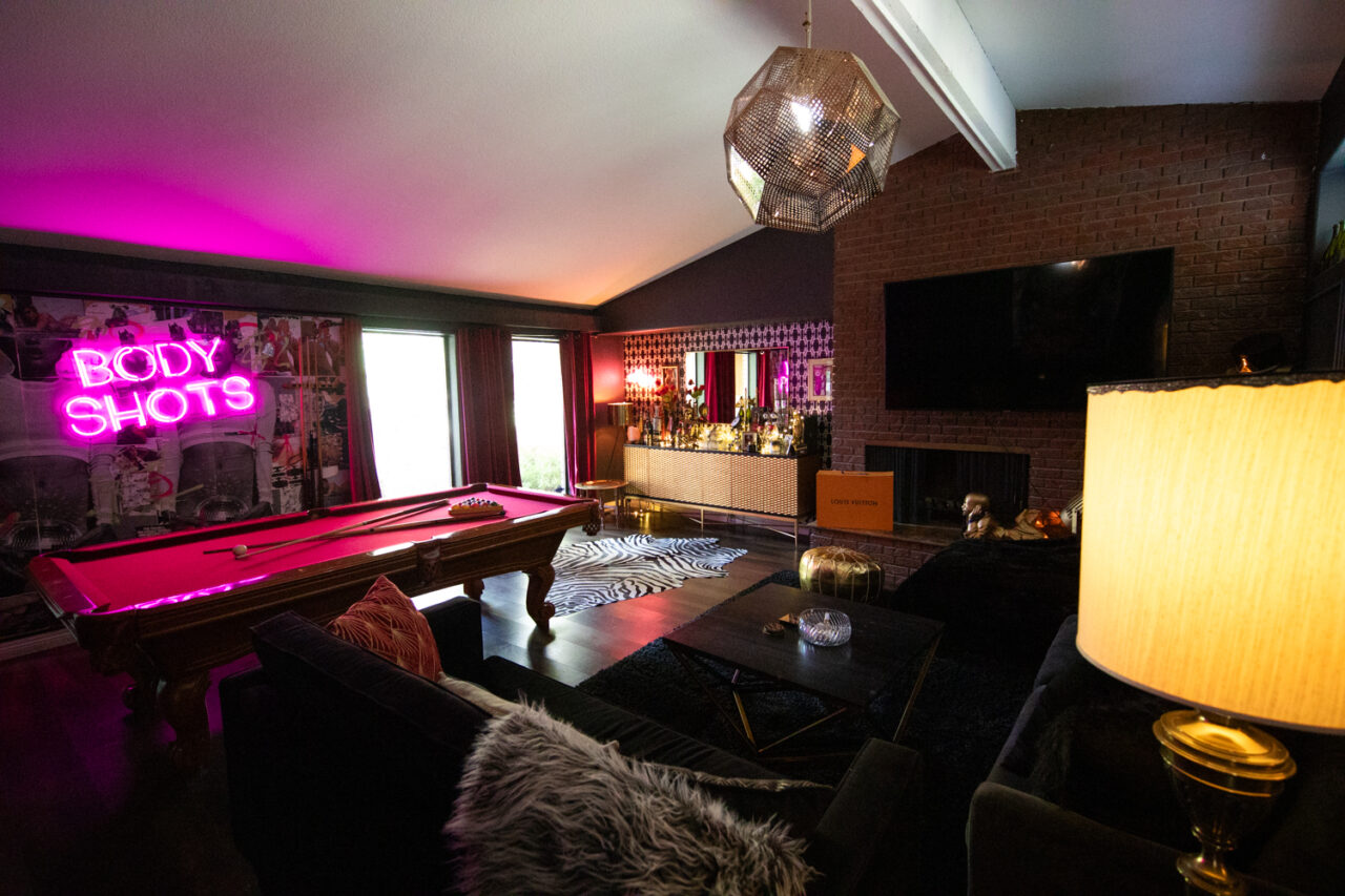 Luxe home bar with pool table and neon signage