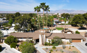 Aerial view of suburban area with mountains in background